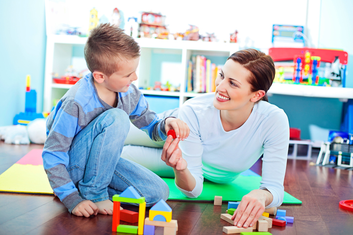 Mother and son playing on floor